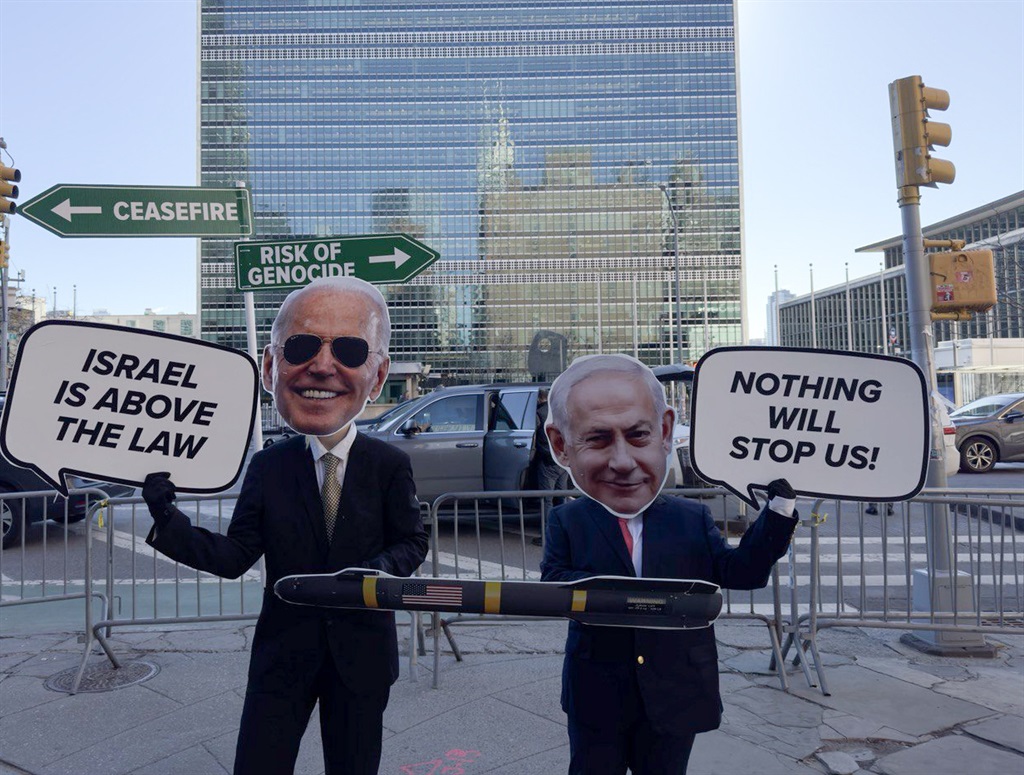 A protest at the UN headquarters in New York in February 2024, featuring the faces of Joe Biden and Benjamin Netanyahu, portrayed as close allies. (Selcuk Acar/Anadolu via Getty Images)