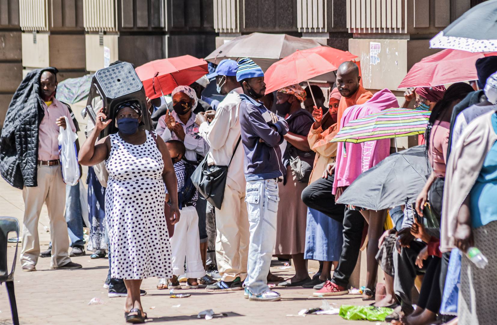 Social grant recipients queue for hours in the hot sun outside the main post office in Pietermaritzburg.