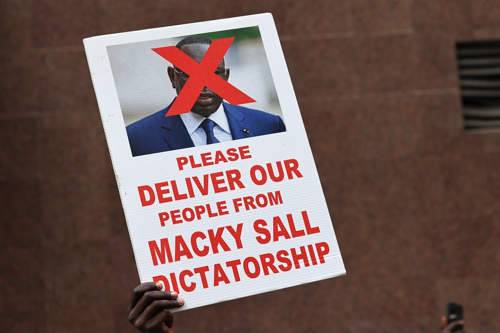 People protest the Senegalese President Macky Sall near the United Nations General Assembly on September 21, 2021 in New York City. (Photo by Michael M. Santiago/Getty Images)