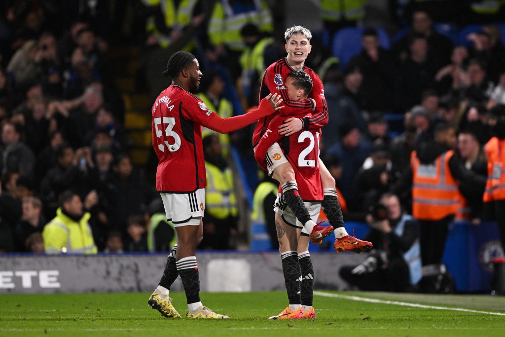 LONDON, ENGLAND - APRIL 04: Alejandro Garnacho of Manchester United celebrates scoring his teams third goal with teammates Willy Kambwala and Antony  during the Premier League match between Chelsea FC and Manchester United at Stamford Bridge on April 04, 2024 in London, England. (Photo by Mike Hewitt/Getty Images) (Photo by Mike Hewitt/Getty Images)