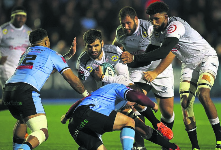 Ruben van Heerden of the Sharks is tackled by Will Boyde and Willis Halaholo of Cardiff Blues during their uninspiring United Rugby Championship match at Cardiff Arms Park in Wales, on Saturday.