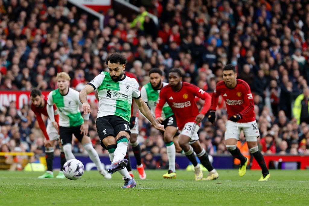 MANCHESTER, ENGLAND - APRIL 7: Mohamed Salah of Liverpool scores to make it 2-2 during the Premier League match between Manchester United and Liverpool FC at Old Trafford on April 7, 2024 in Manchester, England.(Photo by James Baylis - AMA/Getty Images)