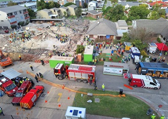 George building collapse: Heavy machinery, cranes roll in to assist with 'slow, careful' rescue