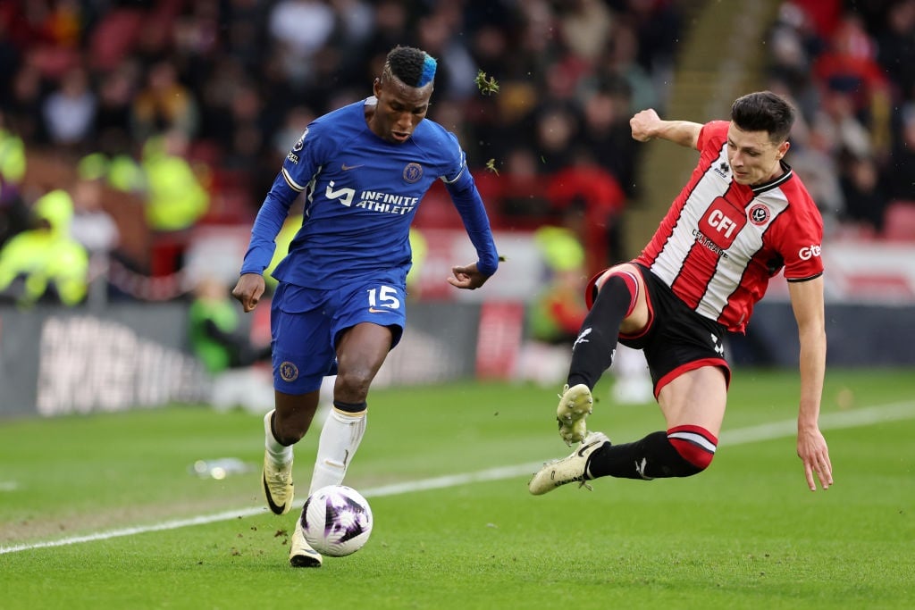 SHEFFIELD, ENGLAND - APRIL 07: Nicolas Jackson of Chelsea runs with the ball whilst under pressure from Anel Ahmedhodzic of Sheffield United during the Premier League match between Sheffield United and Chelsea FC at Bramall Lane on April 07, 2024 in Sheffield, England. (Photo by Jan Kruger/Getty Images)