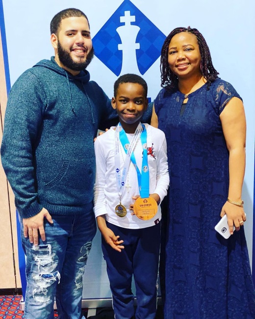 Tani with his chess coach, Shawn Martinez, and his mom, Oluwatoyin. (CREDIT: Facebook)