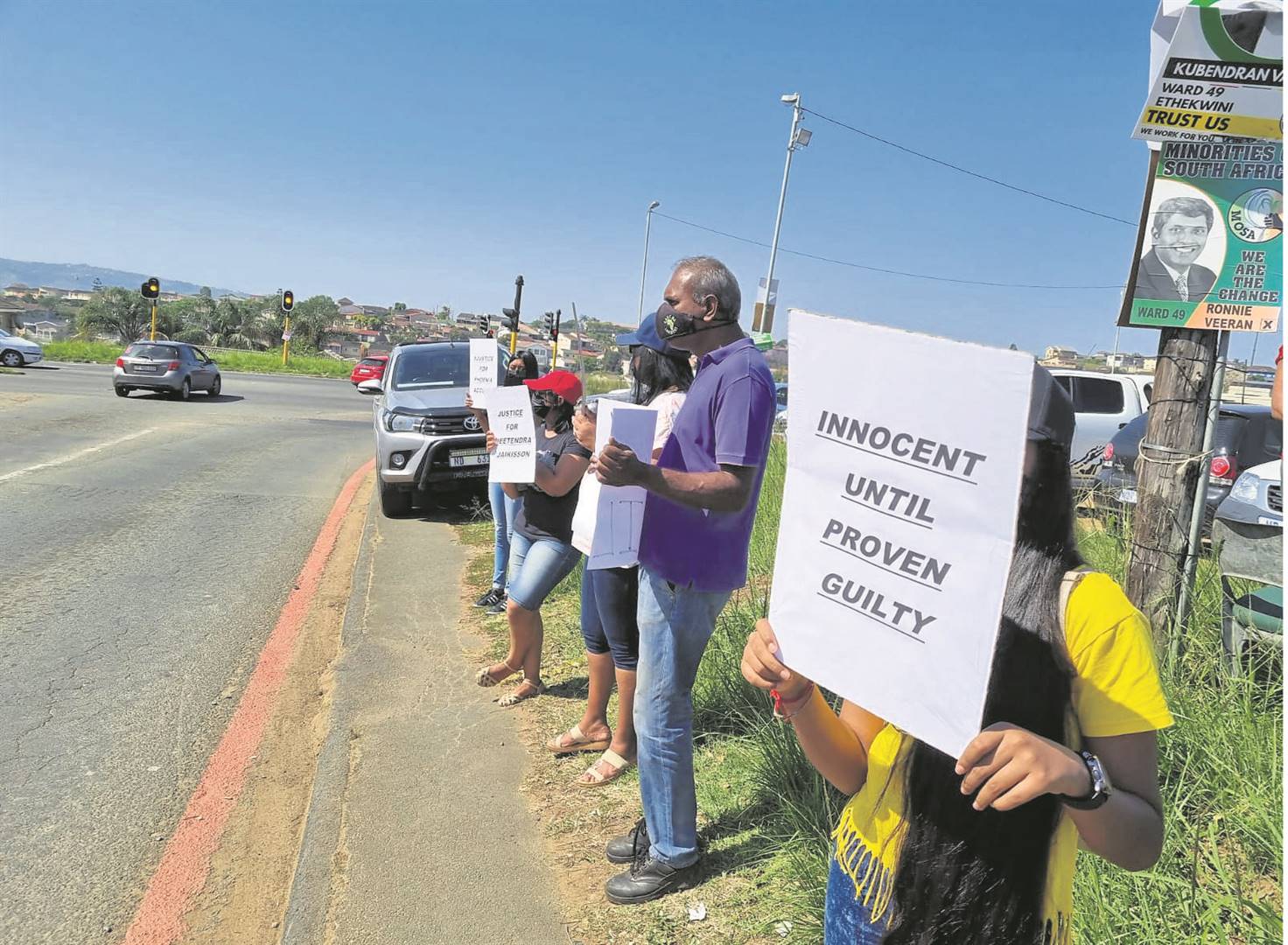 Phoenix community members hold a placard demonstration outside the Phoenix Police Station, following the news of Jeetendra Jaikissoon’s death.