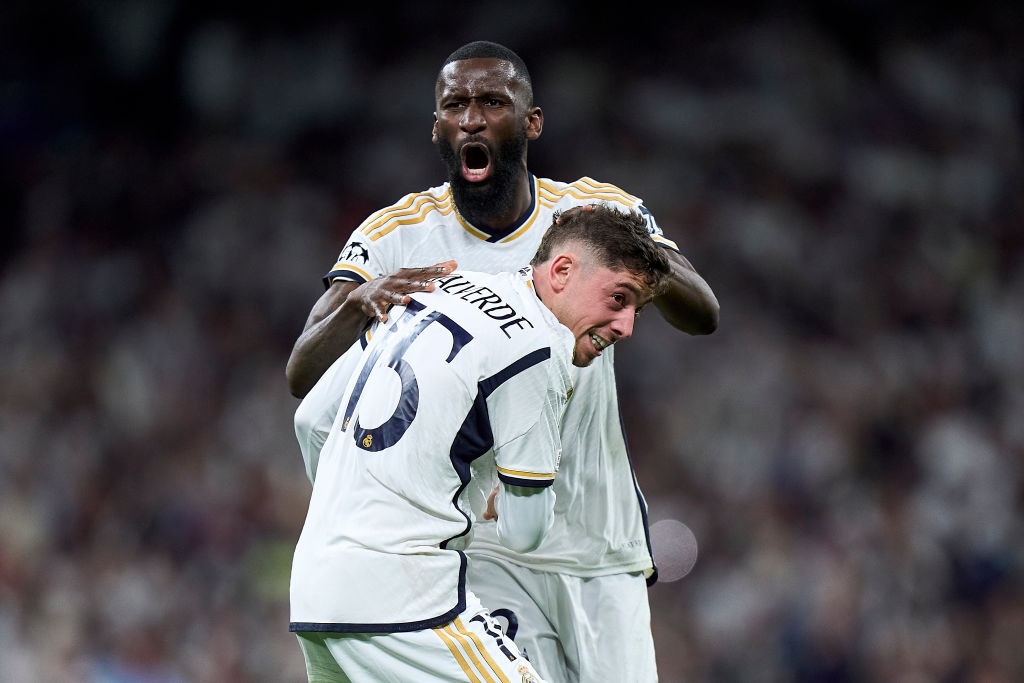 MADRID, SPAIN - APRIL 09: Federico Valverde of Real Madrid celebrates after scoring his teams third goal with teammate Antonio Rudiger during the UEFA Champions League quarter-final first leg match between Real Madrid CF and Manchester City at Estadio Santiago Bernabeu on April 09, 2024 in Madrid, Spain. (Photo by Diego Souto/Getty Images)
