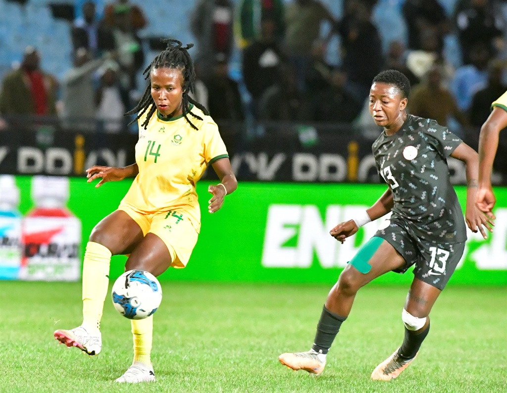 PRETORIA, SOUTH AFRICA - APRIL 09:  Kgoale of South Africa and Abiodun of Nigeria during the CAF Womens Olympic Qualifier Final Round - 2nd Leg match between South Africa and Nigeria at Loftus Versfeld on April 09, 2024 in Pretoria, South Africa. (Photo by Sydney Seshibedi/Gallo Images)