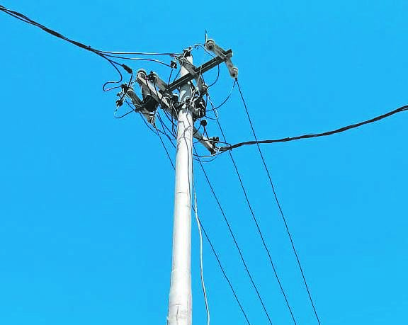 Electricity cables on a utility post that has been tampered with hang loose. PHOTO: kaylynne bantom
