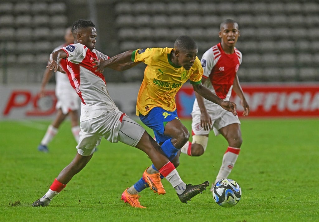 Neo Maema of Mamelodi Sundowns is challenged by Katleho Maphathe of Cape Town Spurs during the DStv Premiership 2023/24 football match between Cape Town Spurs and Mamelodi Sundowns at Athlone Stadium on 9 April 2024 