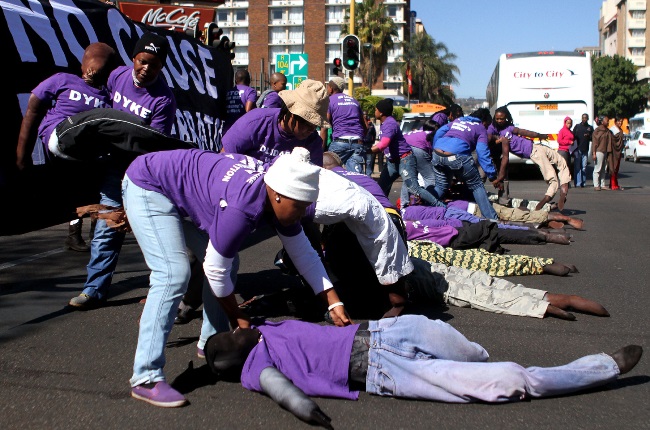 Activists from the One in Nine Campaign protesting at the Union Buildings on Women's Day in 2012. One in Nine is one of many anti-GBV groups formed in response to the prevalence of rape in SA.