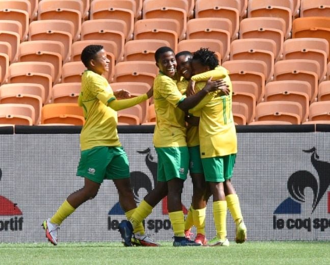 Banyana Banyana players celebrating a goal against Mzoambique