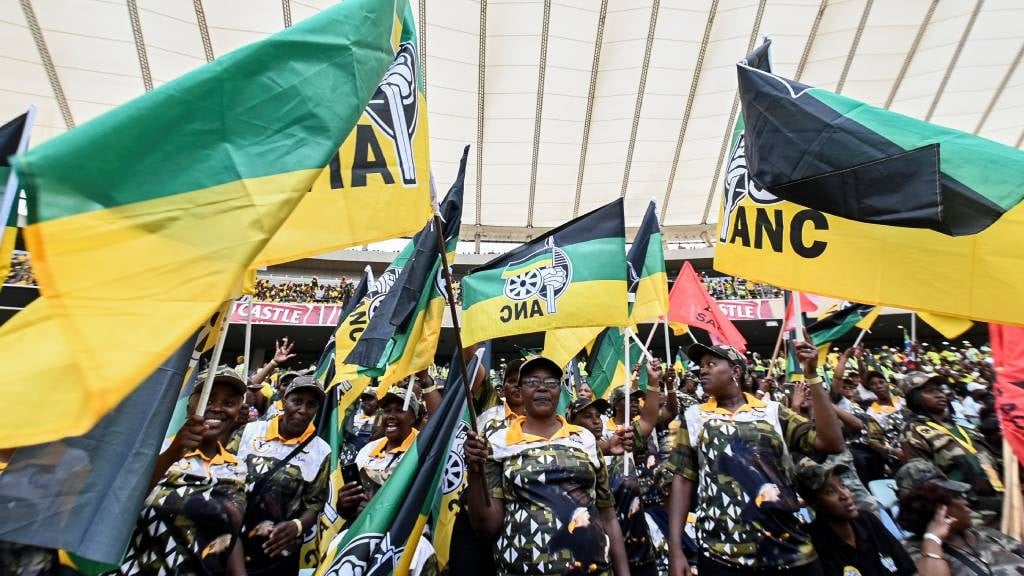 Supporters hold up flags at the African National Congress (ANC) Election Manifesto Launch at Moses Mabhida Stadium in Durban. (Darren Stewart/Gallo Images)
