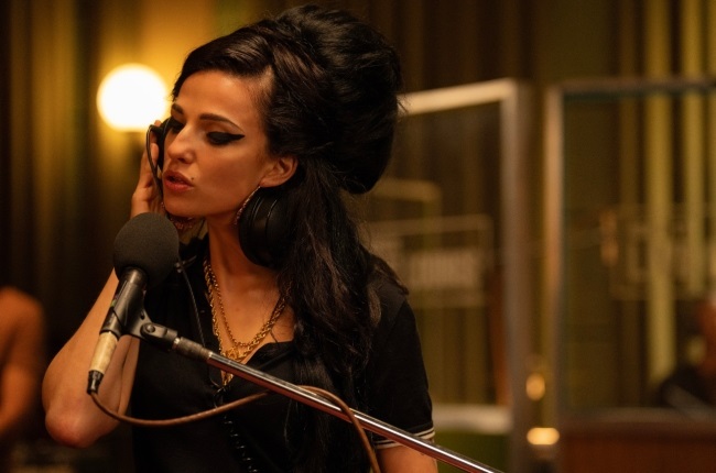 Marisa Abela does a decent job as Amy Winehouse especially. with her vocal portrayal.
