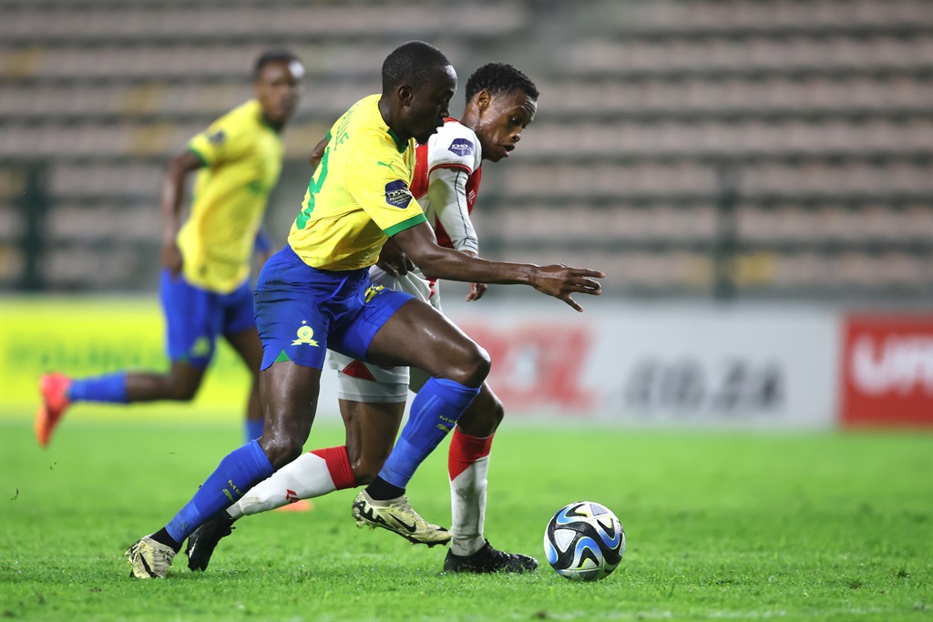 CAPE TOWN, SOUTH AFRICA - APRIL 09: Peter Shalulile of Mamelodi Sundowns is challenged by Asanele Velebayi of Cape Town Spurs during the DStv Premiership match between Cape Town Spurs and Mamelodi Sundowns at Athlone Stadium on April 09, 2024 in Cape Town, South Africa. (Photo by Shaun Roy/Gallo Images)