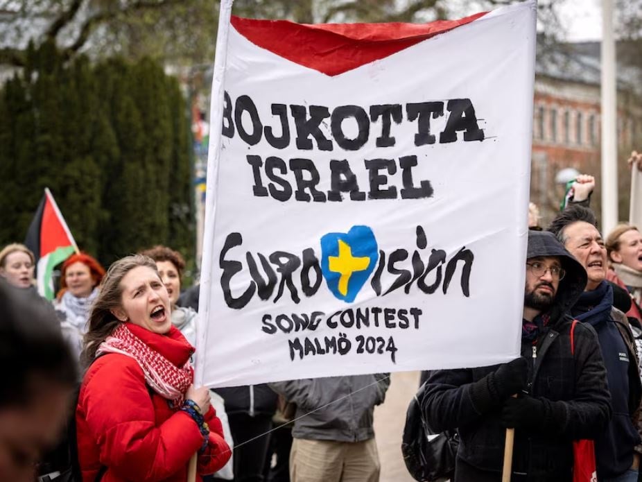 People hold a banner at a demonstration in connection with the municipal board's consideration of a citizens' proposal by the initiative 'No Eurovision in Malmo with Israel's participation' to stop Israel's participation in Eurovision, outside the City Hall in Malmo, Sweden, April 10. Photo by Reuters