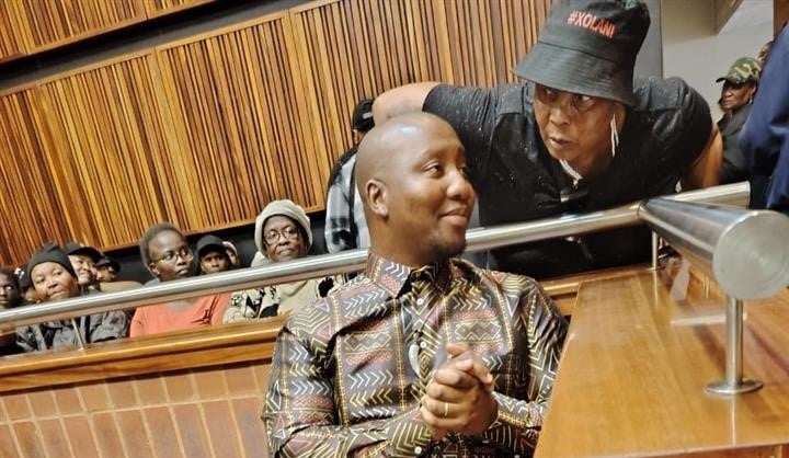 Ex-Sizok'thola presenter Xolani Khumalo was comforted by one of his supporters inside the Palm Ridge Magistrates Court. Photo by Happy Mnguni