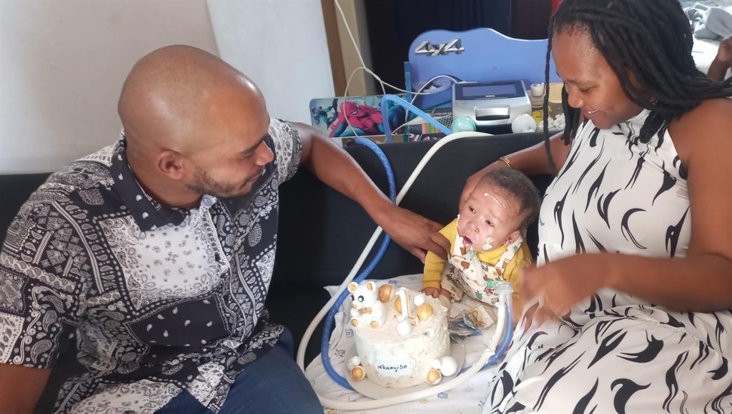 Phumelele Nxumalo and Lindelani Mpanza pray for their child, Nkanyiso, to stay alive. 