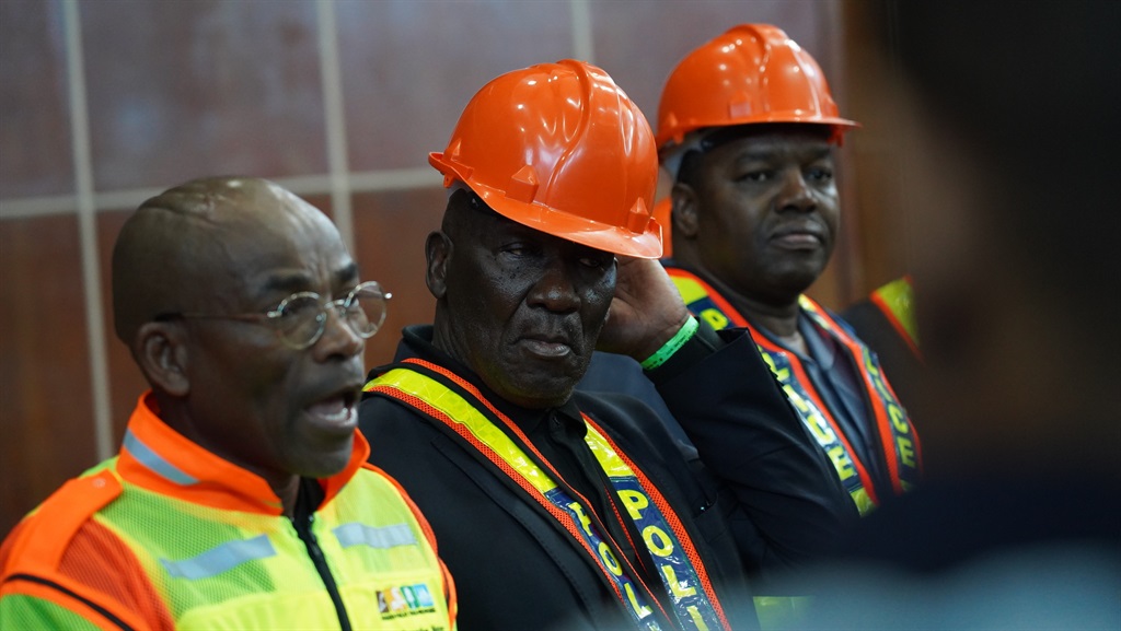 Minister of Police Bheki Cele alongside National Commissioner, General Fannie Masemola, addressing affected families at the city hall in George, Western Cape. (Alfonso Nqunjana/News24)