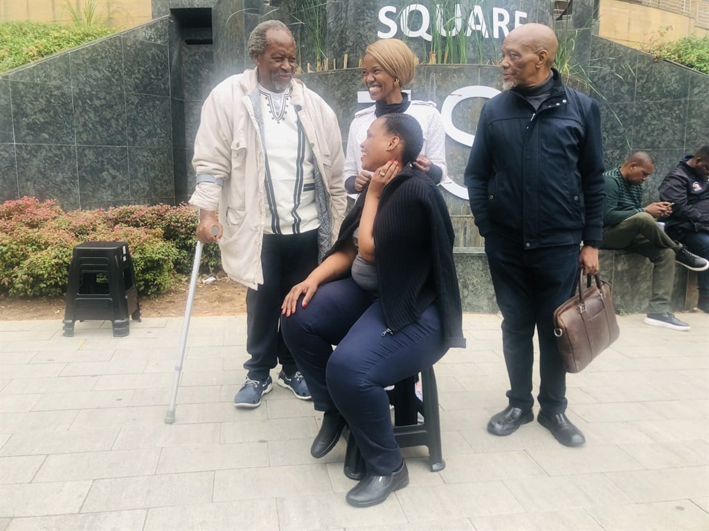 From left: Father of Alexandra Linda Twala, Unemployed Need Transformation beauty trainee Nozizwe Mabena and former North West premier, Job Mokgoro on the doorsteps of the Joburg Stock Exchange in Sandton. Photo by Sylvester Sibiya