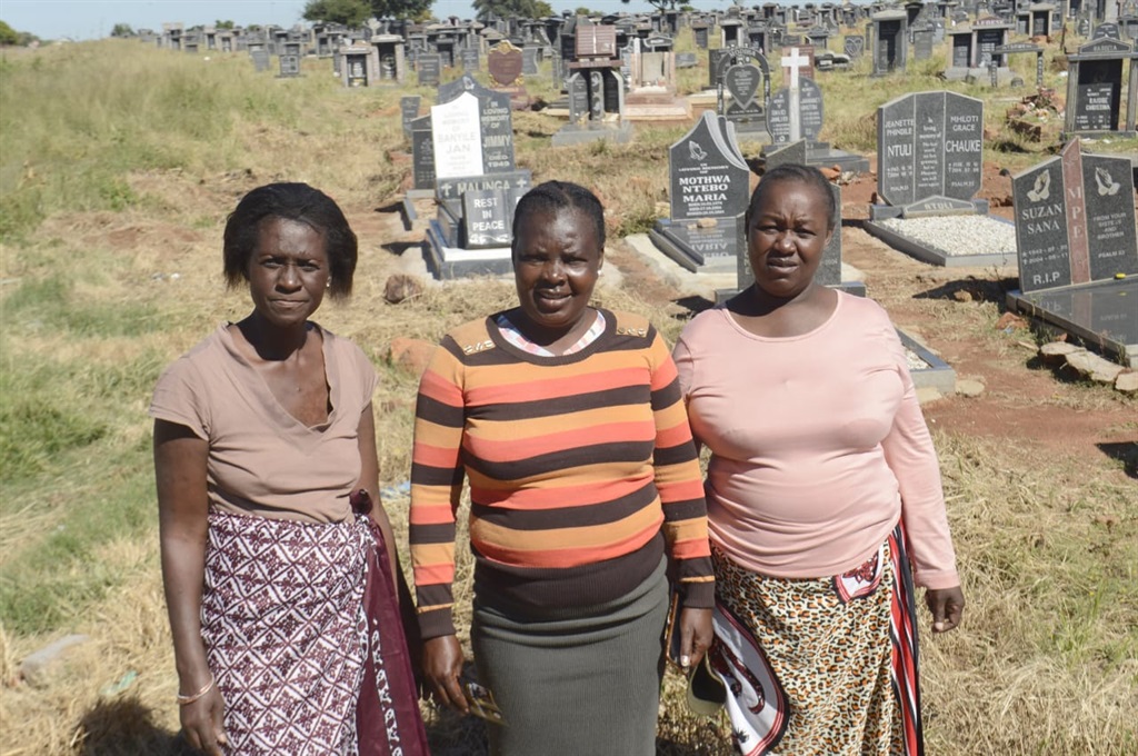 From left: Sangoma Sandra Maswanganye, Pastor Lizza Maluleke and sangoma Evelyn Mushadu are not happy after thugs stole a fence from the gravesite. Photo by Raymond Morare