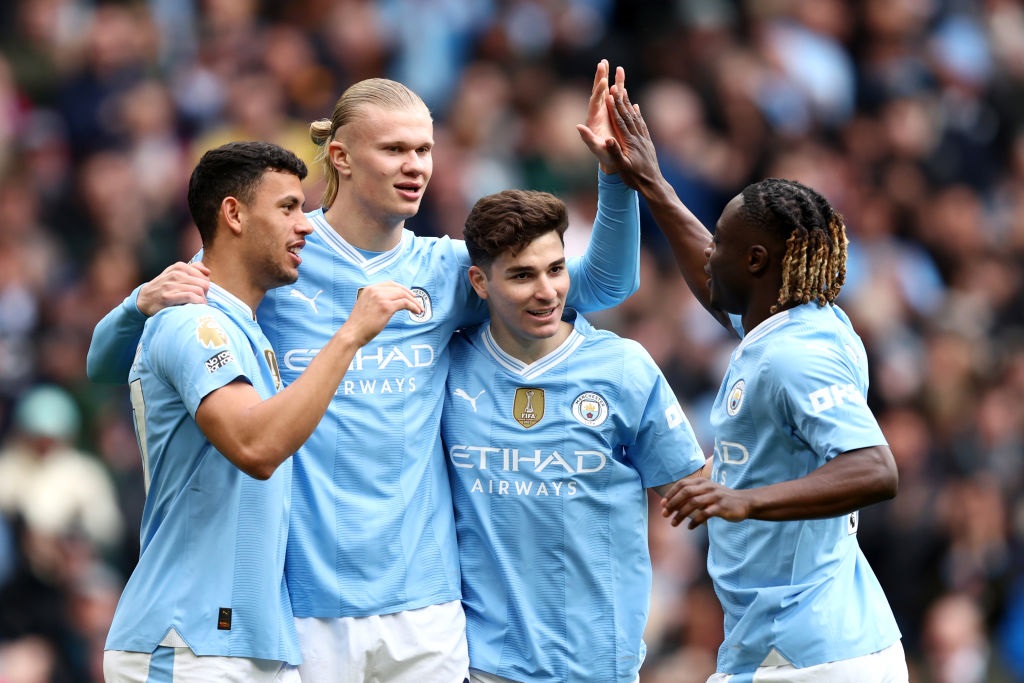 MANCHESTER, ENGLAND - APRIL 13: Erling Haaland of Manchester City celebrates with teammates after Daiki Hashioka of Luton Town (not pictured) scores an own goal, the first goal for Manchester City during the Premier League match between Manchester City and Luton Town at Etihad Stadium on April 13, 2024 in Manchester, England. (Photo by Matt McNulty/Getty Images) (Photo by Matt McNulty/Getty Images)
