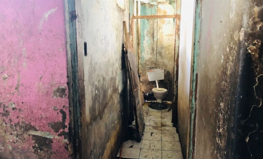 Inside one of the “dark buildings” in central Johannesburg where thousands of immigrants live. (Photos: Kimberly Mutandiro)