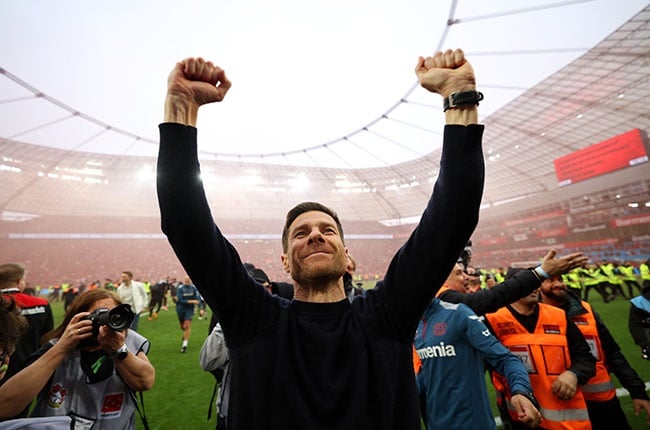  Xabi Alonso, head coach of Bayer Leverkusen, celebrates after the team's victory against Bremen and winning the Bundesliga title for the first time in their history on Sunday. (Lars Baron/Getty Images)