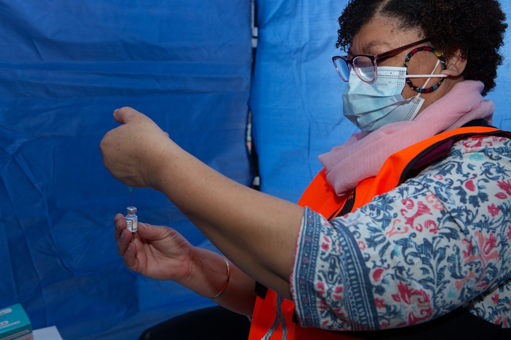 An official prepares a dose of Pfizer's Covid-19 vaccine in Cape Town. (Gallo Images/Misha Jordaan)