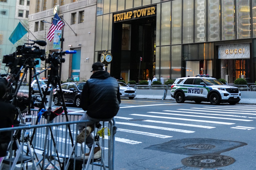Media wait in front of Trump Tower, from where former US President Donald Trump was expected to depart for the Manhattan Criminal Court, to attend the first day of his trial for allegedly covering up hush money payments linked to extramarital affairs. (CHARLY TRIBALLEAU / AFP)