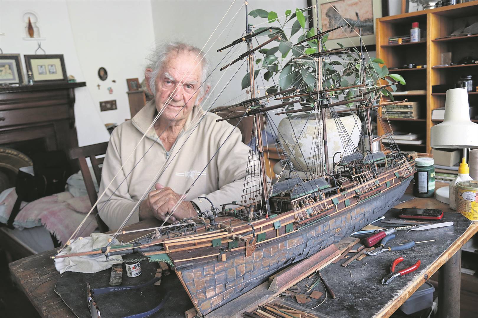 Roger Berry (76) crafts model ships.