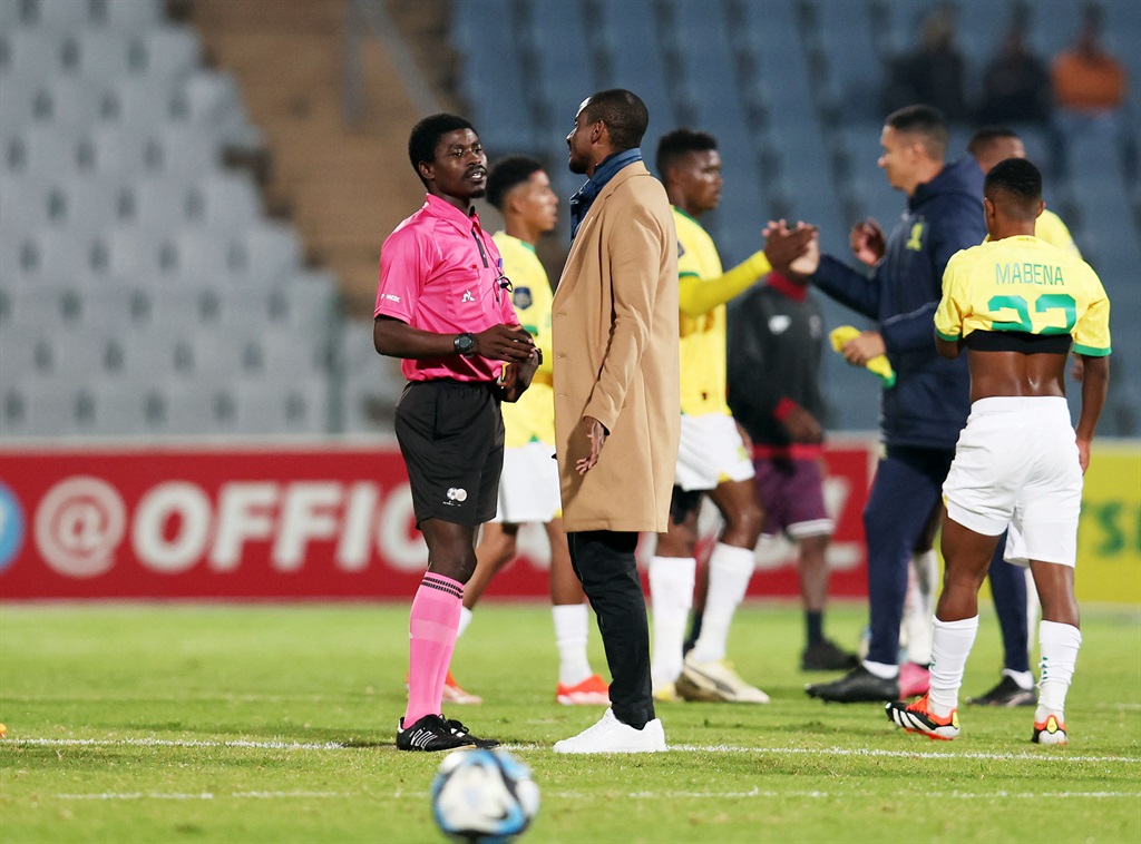 Mameodi Sundowns head coach Rulani Mokwena makes his point across to referee Jelly Chavani during Downs' DStv Premiership game against Moroka Swallows in Soweto on 15 April. 