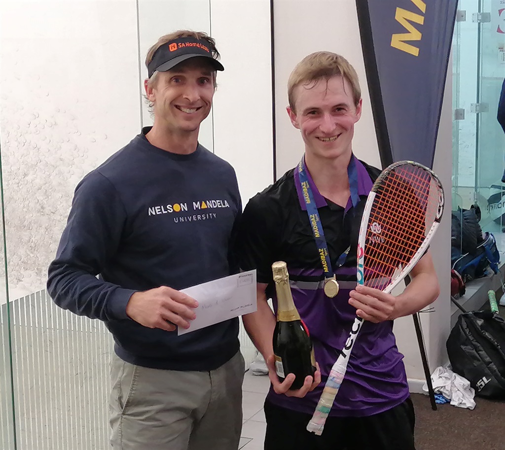 Tournament director Jason le Roux, left, congratulates North-West University’s Tristen Worth after he won the Nelson Mandela University Open men’s squash title at Crusaders in Gqeberha on Sunday. 