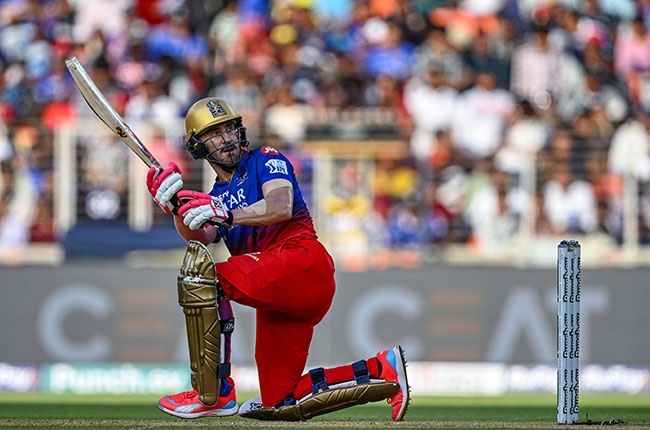 Royal Challengers Bengaluru's captain Faf du Plessis of South Africa watches the ball after playing a shot during the Indian Premier League (IPL) Twenty20 match. (Punit PARANJPE / AFP)
