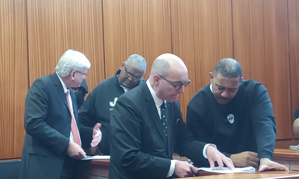 Terrence Joubert consults with his attorney, Neil Ristow (left), while Anwar Khan (right) speaks to his attorney, Reuben Liddell. (Sithandiwe Velaphi/News24)