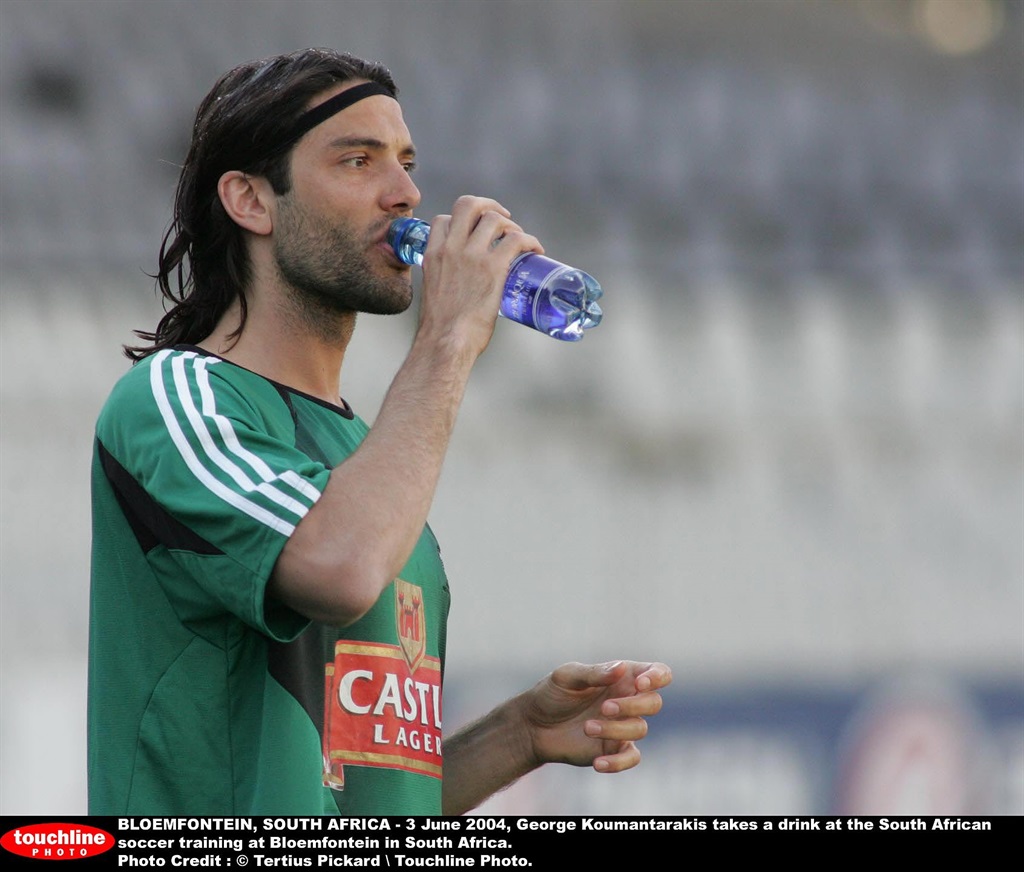 BLOEMFONTEIN, SOUTH AFRICA - 3 June 2004, George Koumantarakis takes a drink at the South African soccer training at Bloemfontein in South Africa.