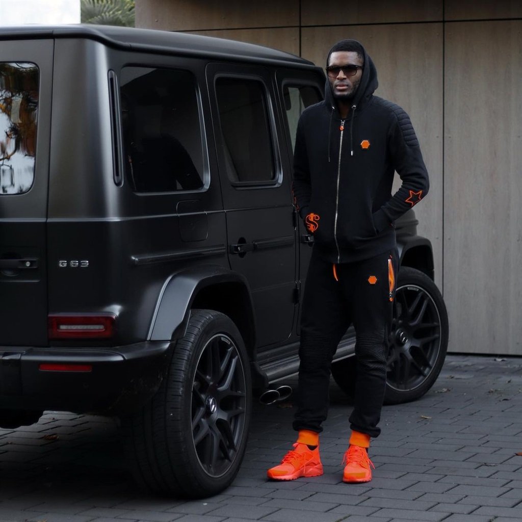Anthony Modeste with a Mercedes Benz G-Wagon.