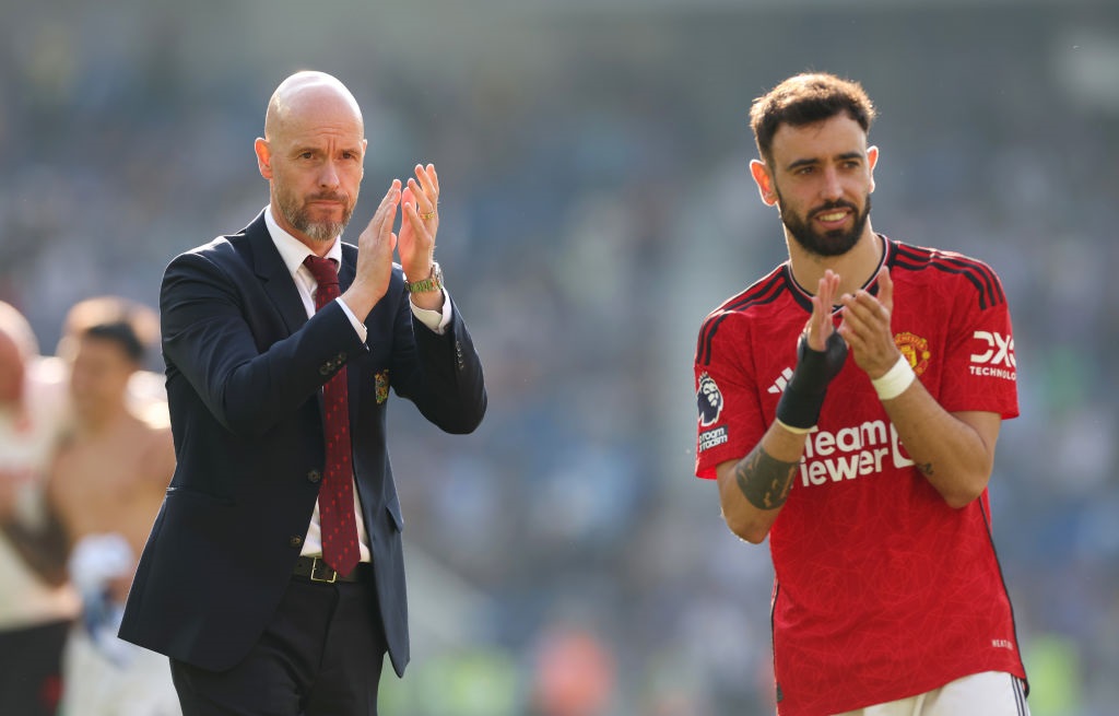 BRIGHTON, ENGLAND - MAY 19: Erik ten Hag, Manager of Manchester United, applauds the fans alongside Bruno Fernandes of Manchester United after the teams victory in the Premier League match between Brighton & Hove Albion and Manchester United at American Express Community Stadium on May 19, 2024 in Brighton, England. (Photo by Michael Steele/Getty Images)