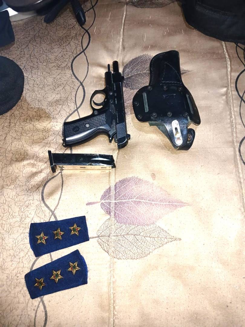 Some of the police equipment, insignia, and uniforms that were found in possession of three suspects in Galeshewe, Kimberley. 