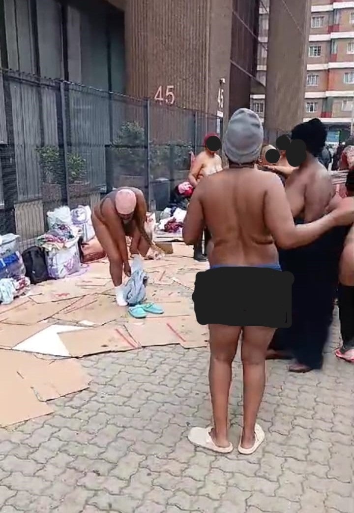 Security guards stripped naked outside the Gauteng Department of Health building on Tuesday, April 16. 