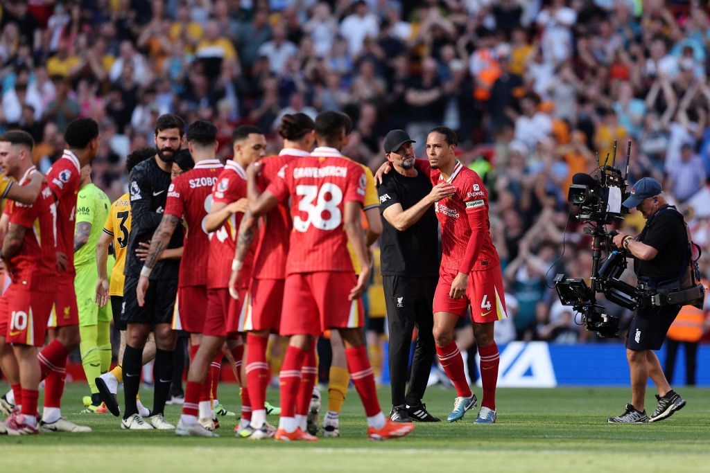 Jurgen Klopp embraces Virgil van Dijk of Liverpool after the teams victory during the Premier League  clash against Wolverhampton Wanderers at Anfield on May 19, 2024 in Liverpool, England. (Clive Brunskill/Getty Images)