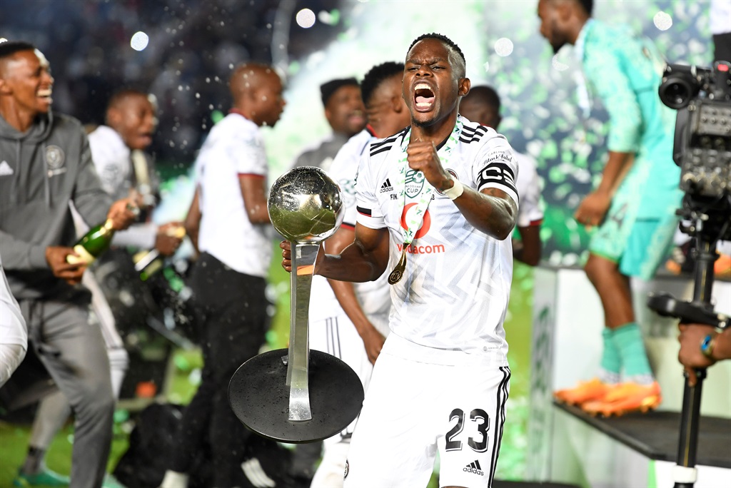 Orlando Pirates captain Innocent Maela lifts the Nedbank Cup Trophy with teammates  during the Nedbank Cup final match between Orlando Pirates and Sekhukhune United at Loftus Versfeld Stadium on March 27, 2023 in Pretoria, South Africa.