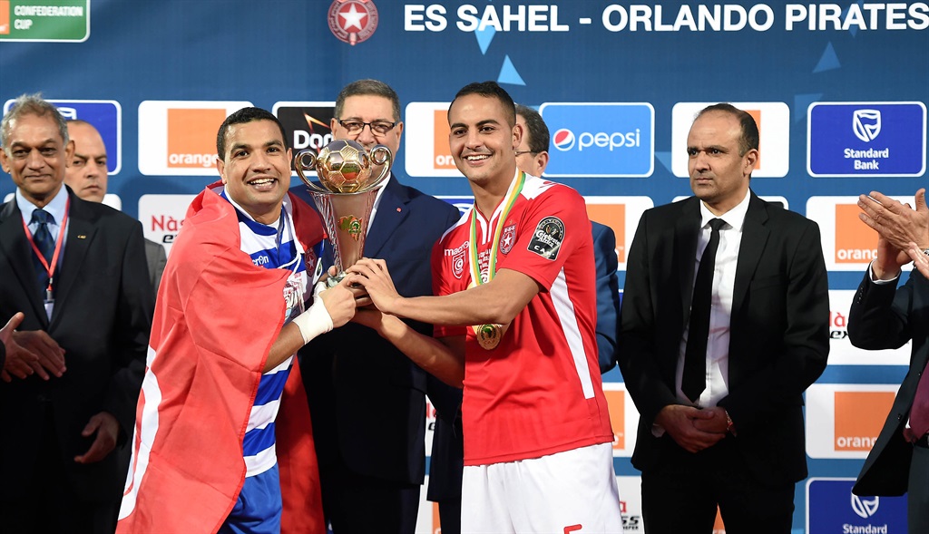 SOUSSE, TUNISIA - NOVEMBER 29: Aymen Belbouli and Ammar Jmer of Etoile du Sahel celebrate with the trophy  during the CAF Confederation Cup Final 2nd Leg match between Etoile du Sahel and Orlando Pirates at Olympic Stadium on November 29, 2015 in Sousse, Tunisia. (Photo by Mohamed Khalil/Gallo Images)