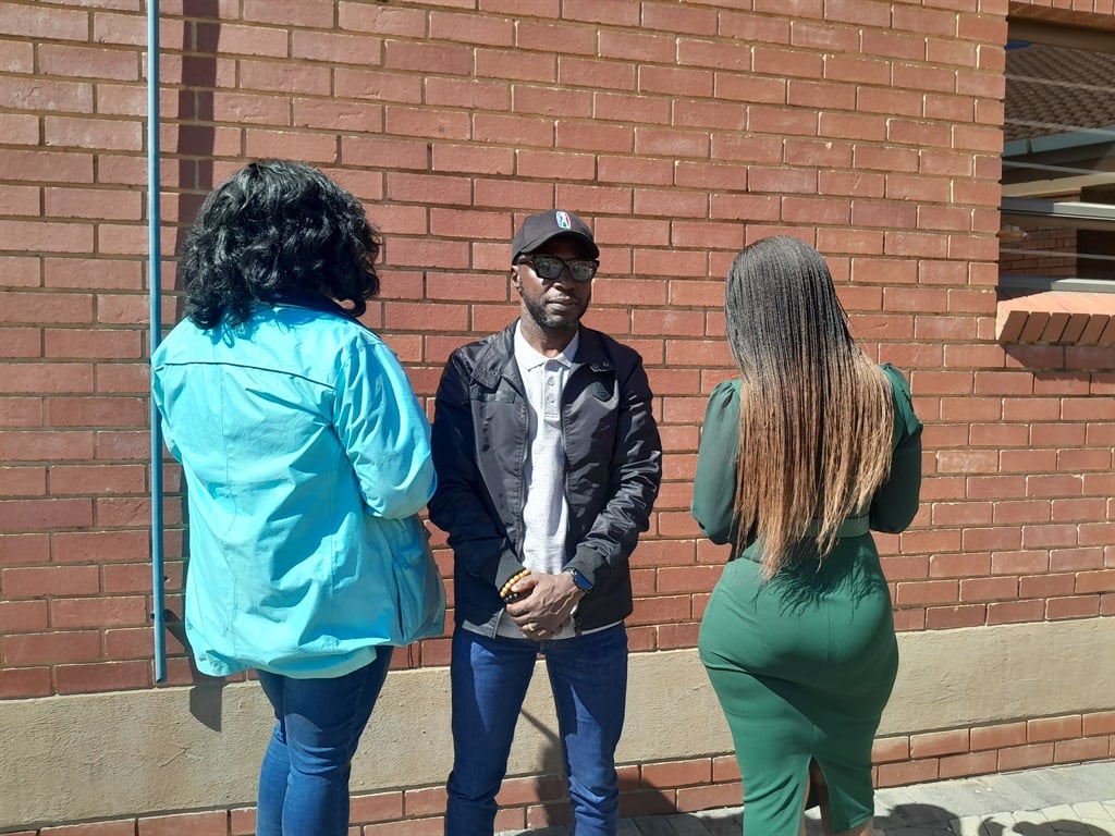 Christian activist Solomon Ashoms with two of four victims. Photos Ntebatse Masipa