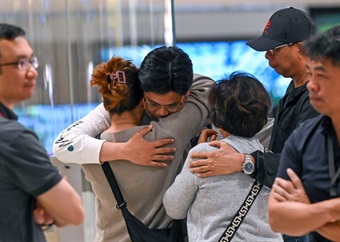 Shaken passengers from turbulence-hit flight arrive in Singapore