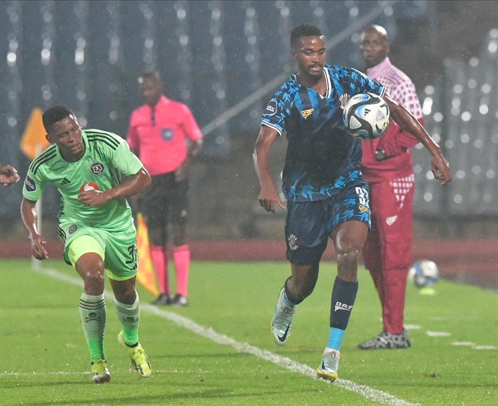 Moroka Swallows midfielder Jacob Everson challenges for the ball with Orlando Pirates defender Thabiso Lebitso during a Soweto derby DStv Premiership clash at Dobsonville Stadium in Soweto on 3 April 2024. 