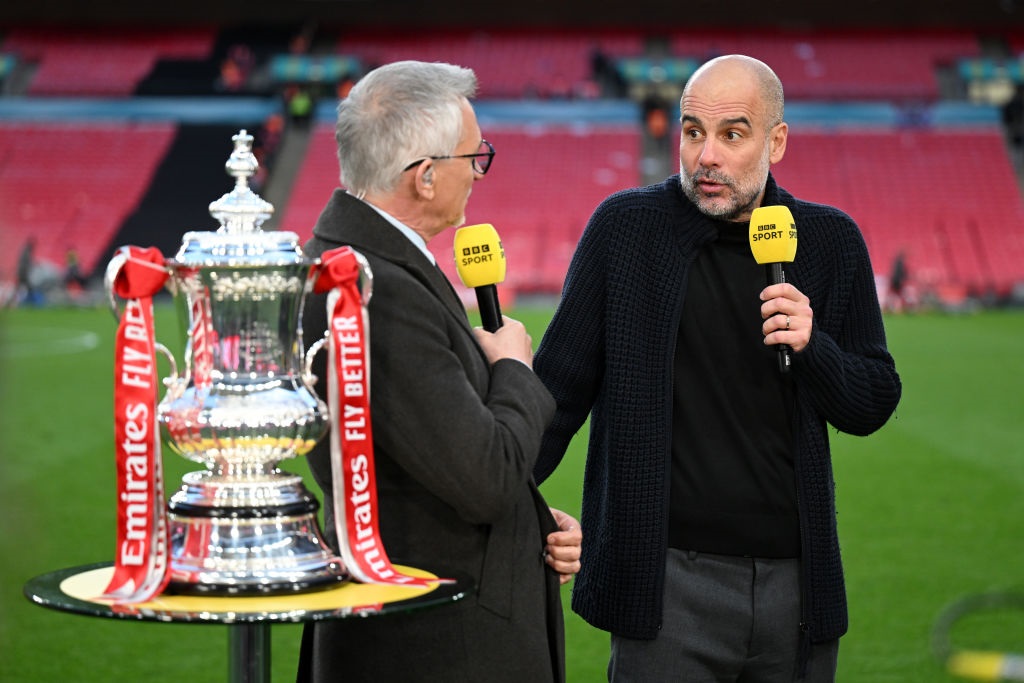 LONDON, ENGLAND - APRIL 20: Gary Lineker speaks to Pep Guardiola, Manager of Manchester City, with the FA Cup trophy after the teams victory the Emirates FA Cup Semi Final match between Manchester City and Chelsea at Wembley Stadium on April 20, 2024 in London, England. (Photo by Michael Regan - The FA/The FA via Getty Images)
