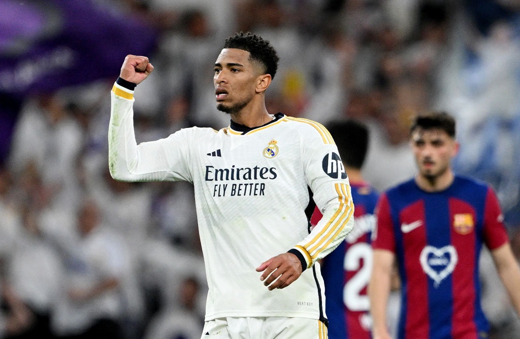 MADRID, SPAIN - APRIL 21: Jude Bellingham of Real Madrid celebrates scoring his teams third goal during the LaLiga EA Sports match between Real Madrid CF and FC Barcelona at Estadio Santiago Bernabeu on April 21, 2024 in Madrid, Spain. (Photo by David Ramos/Getty Images)