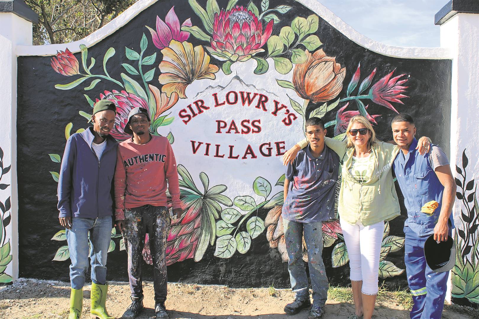The team behind the artworks in Sir Lowry’s Pass Village at the newly painted entrance sign, from left: Ruben Julies, Nigel Meyer, Wayde Spogter, Charlie Vettori (founder) and Keanu Kruger.Photos: Yaseen Gaffar