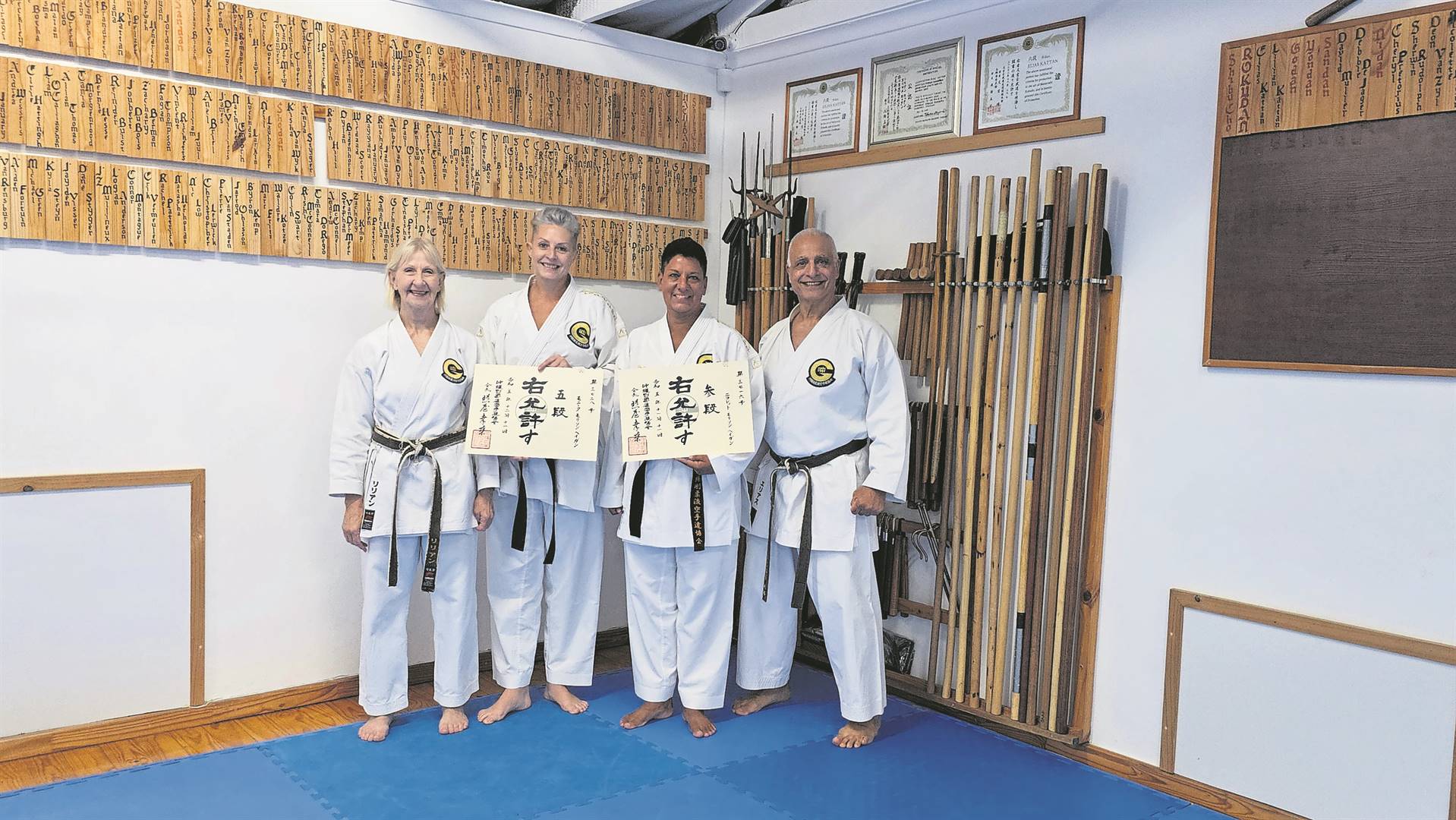 Senseis Monique (OGKK 5th dan) and Nicolette Morrison-Hagen (OGKK 3rd Dan and 2nd Dan in Kobudo) with their authentic Okinawan certificates at the handover ceremony. With them are their senseis Lilian and Elias Kattan (both 8th Dan). FOTO: 